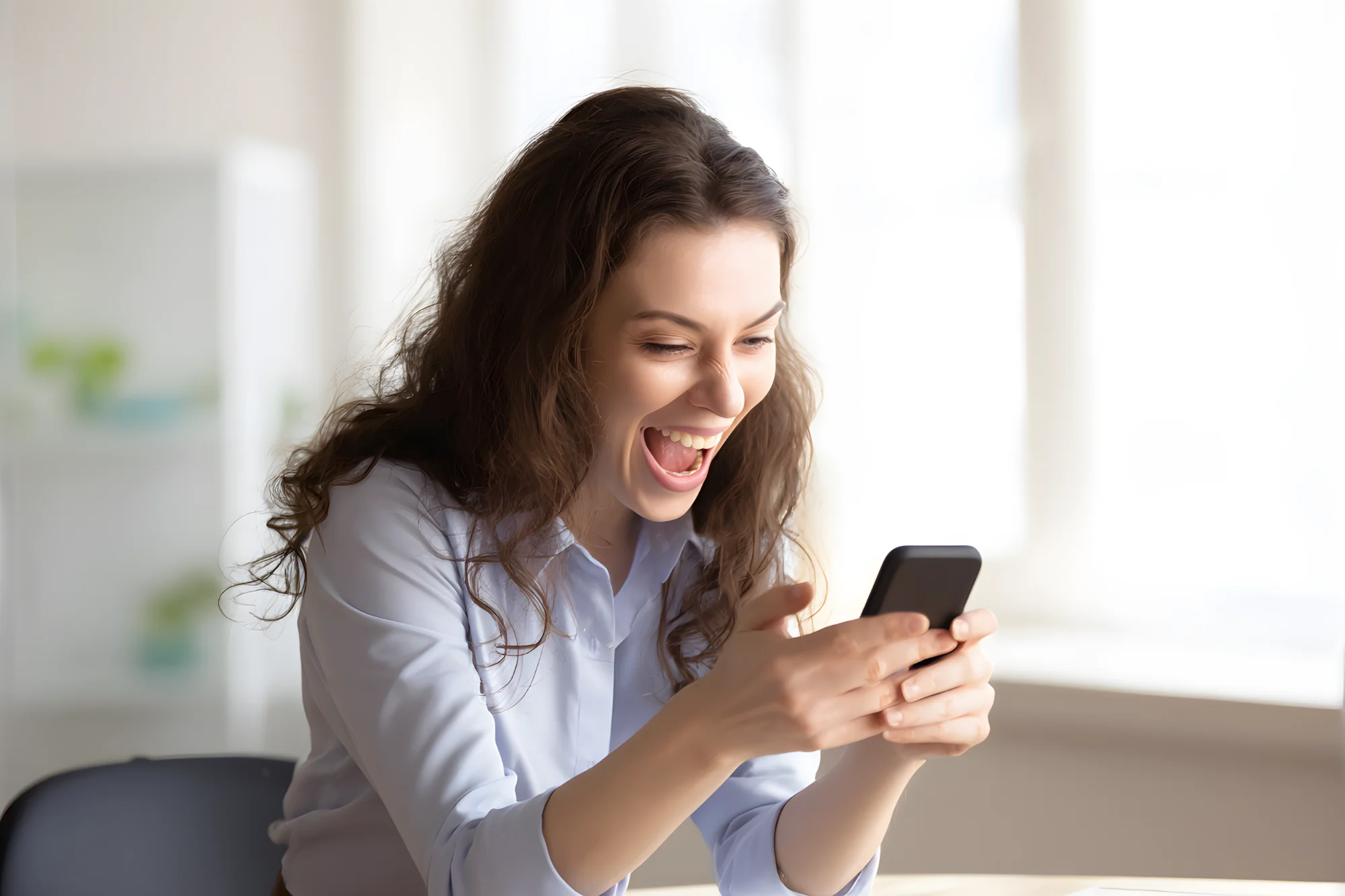 Excited customer receiving Crane Finance loan approval